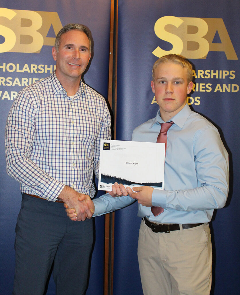 Northern College President presenting an award to a student